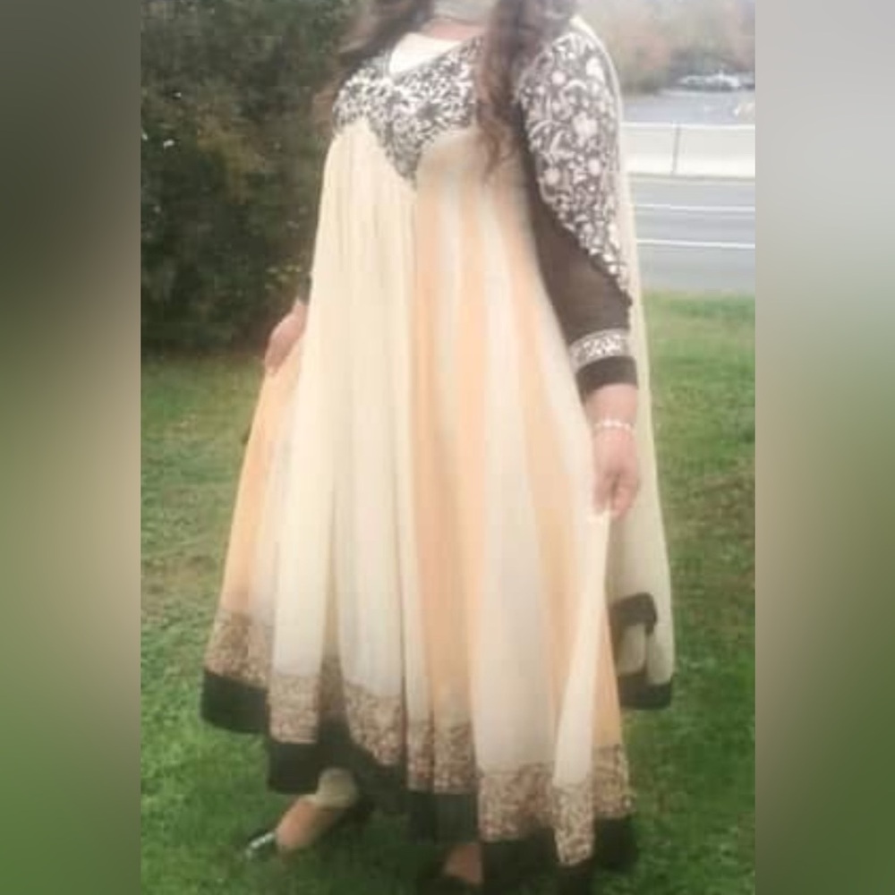 Pakistani original thread and motifs Emboridry Cream and Black Dress
